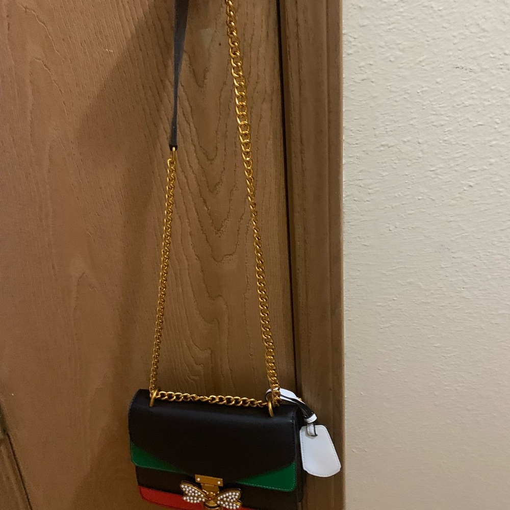 Medium cross body red green black with a bee